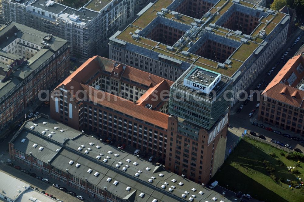 Berlin from above - View at the restored building of the monument protected former Osram respectively Narva company premises Oberbaum City in the district Friedrichshain in Berlin. Here, among many other companies, BASF Services Europe, the German Post Customer Service Center GmbH and Heineken Germany GmbH are located. It is owned by HVB Immobilien AG, which is part of the UniCredit Group