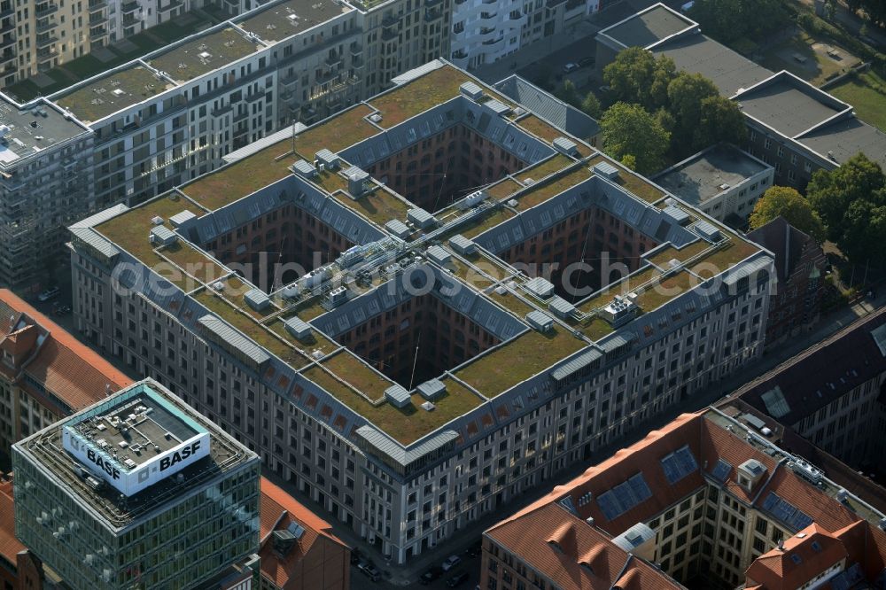 Aerial photograph Berlin - View at the restored building of the monument protected former Osram respectively Narva company premises Oberbaum City in the district Friedrichshain in Berlin. Here, among many other companies, BASF Services Europe, the German Post Customer Service Center GmbH and Heineken Germany GmbH are located. It is owned by HVB Immobilien AG, which is part of the UniCredit Group