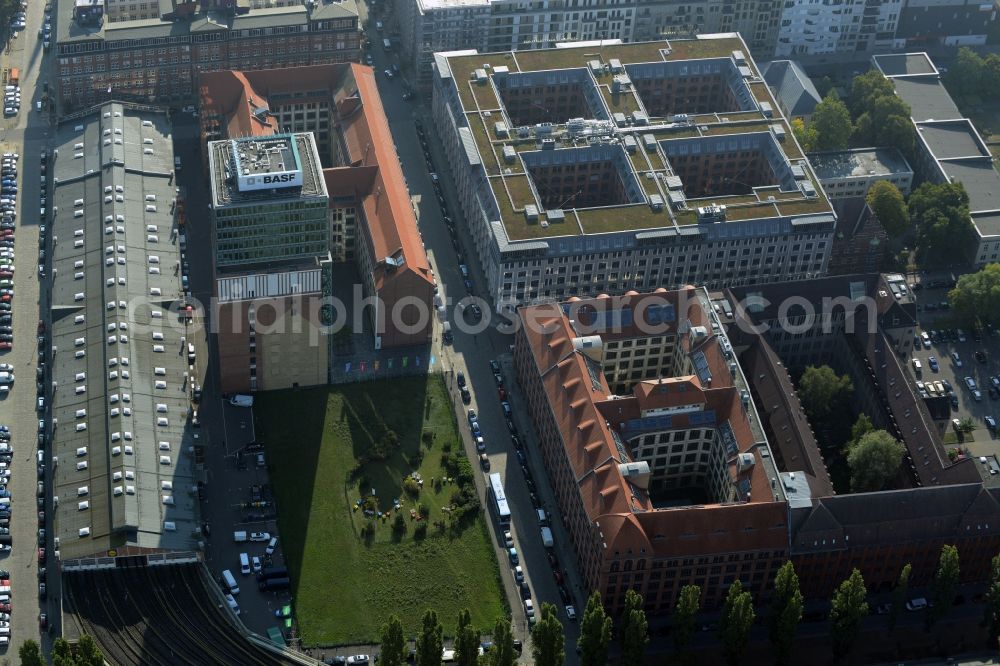 Berlin from the bird's eye view: View at the restored building of the monument protected former Osram respectively Narva company premises Oberbaum City in the district Friedrichshain in Berlin. Here, among many other companies, BASF Services Europe, the German Post Customer Service Center GmbH and Heineken Germany GmbH are located. It is owned by HVB Immobilien AG, which is part of the UniCredit Group