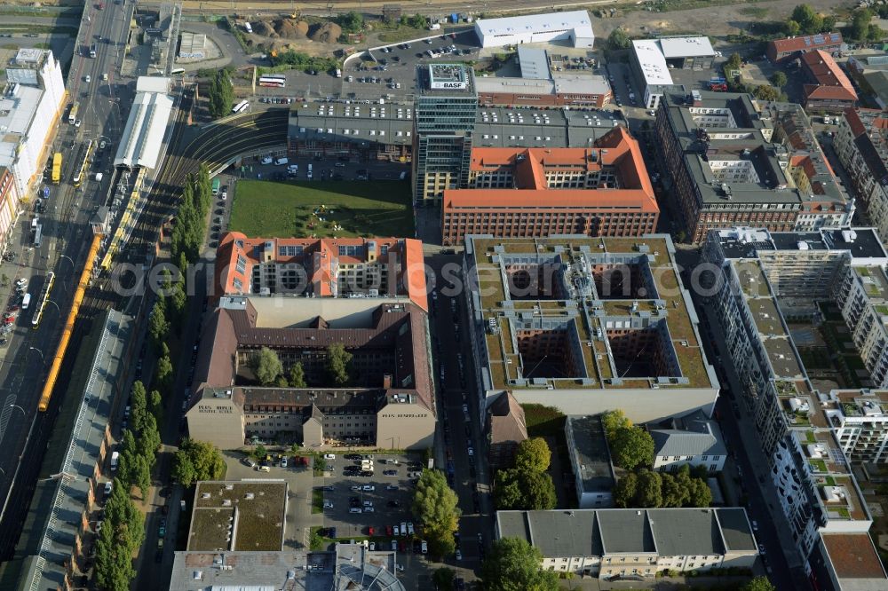 Aerial photograph Berlin - View at the restored building of the monument protected former Osram respectively Narva company premises Oberbaum City in the district Friedrichshain in Berlin. Here, among many other companies, BASF Services Europe, the German Post Customer Service Center GmbH and Heineken Germany GmbH are located. It is owned by HVB Immobilien AG, which is part of the UniCredit Group