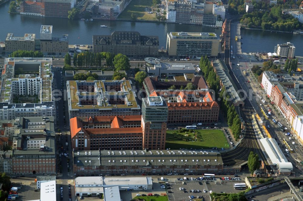 Berlin from above - View at the restored building of the monument protected former Osram respectively Narva company premises Oberbaum City in the district Friedrichshain in Berlin. Here, among many other companies, BASF Services Europe, the German Post Customer Service Center GmbH and Heineken Germany GmbH are located. It is owned by HVB Immobilien AG, which is part of the UniCredit Group