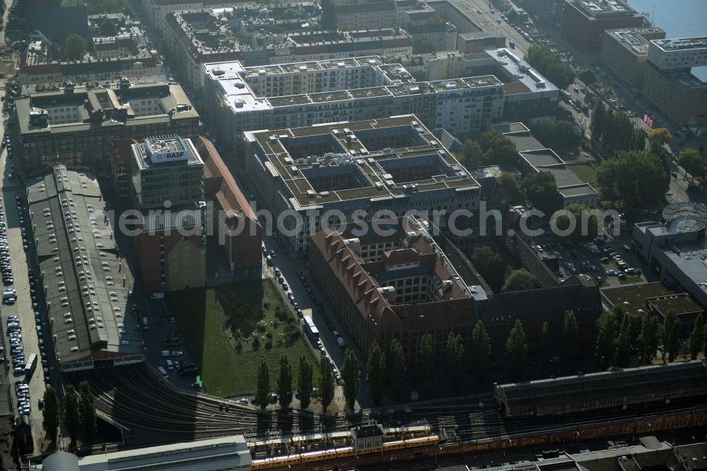 Berlin from above - View at the restored building of the monument protected former Osram respectively Narva company premises Oberbaum City in the district Friedrichshain in Berlin. Here, among many other companies, BASF Services Europe, the German Post Customer Service Center GmbH and Heineken Germany GmbH are located. It is owned by HVB Immobilien AG, which is part of the UniCredit Group