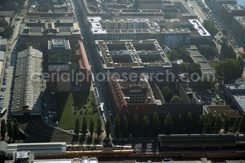 Aerial photograph Berlin - View at the restored building of the monument protected former Osram respectively Narva company premises Oberbaum City in the district Friedrichshain in Berlin. Here, among many other companies, BASF Services Europe, the German Post Customer Service Center GmbH and Heineken Germany GmbH are located. It is owned by HVB Immobilien AG, which is part of the UniCredit Group