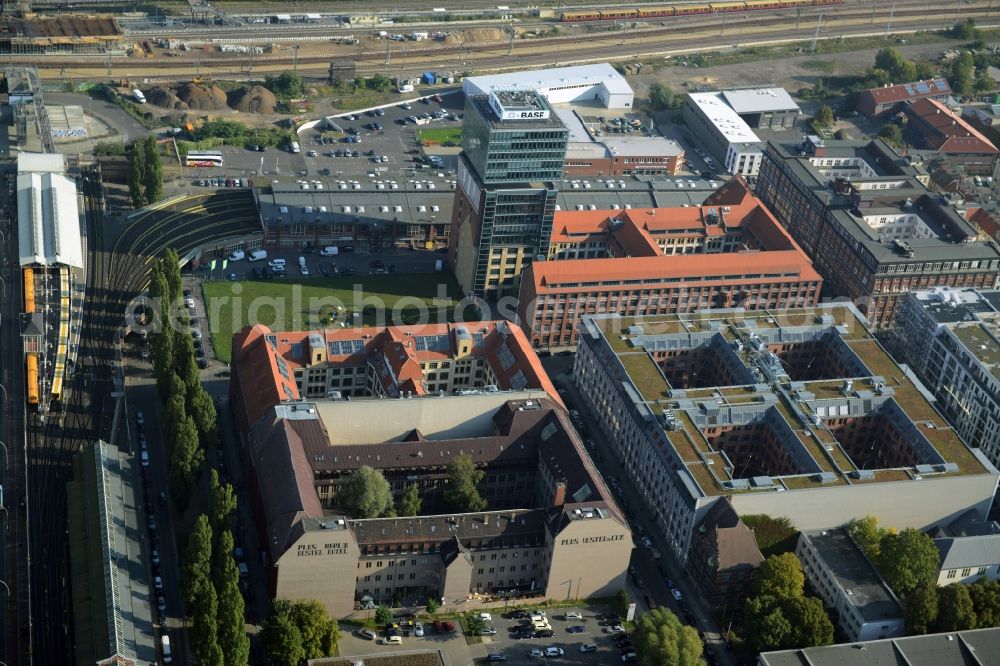 Berlin from above - View at the restored building of the monument protected former Osram respectively Narva company premises Oberbaum City in the district Friedrichshain in Berlin. Here, among many other companies, BASF Services Europe, the German Post Customer Service Center GmbH and Heineken Germany GmbH are located. It is owned by HVB Immobilien AG, which is part of the UniCredit Group