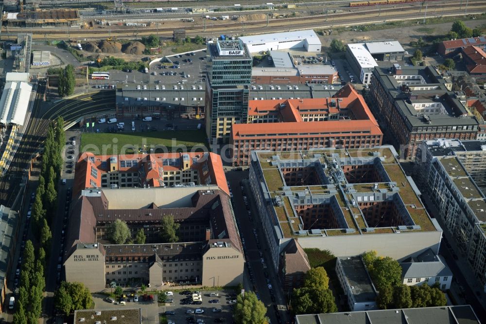 Berlin from the bird's eye view: View at the restored building of the monument protected former Osram respectively Narva company premises Oberbaum City in the district Friedrichshain in Berlin. Here, among many other companies, BASF Services Europe, the German Post Customer Service Center GmbH and Heineken Germany GmbH are located. It is owned by HVB Immobilien AG, which is part of the UniCredit Group