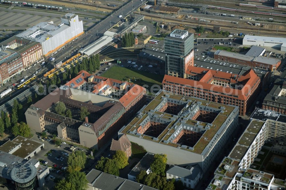 Berlin from above - View at the restored building of the monument protected former Osram respectively Narva company premises Oberbaum City in the district Friedrichshain in Berlin. Here, among many other companies, BASF Services Europe, the German Post Customer Service Center GmbH and Heineken Germany GmbH are located. It is owned by HVB Immobilien AG, which is part of the UniCredit Group