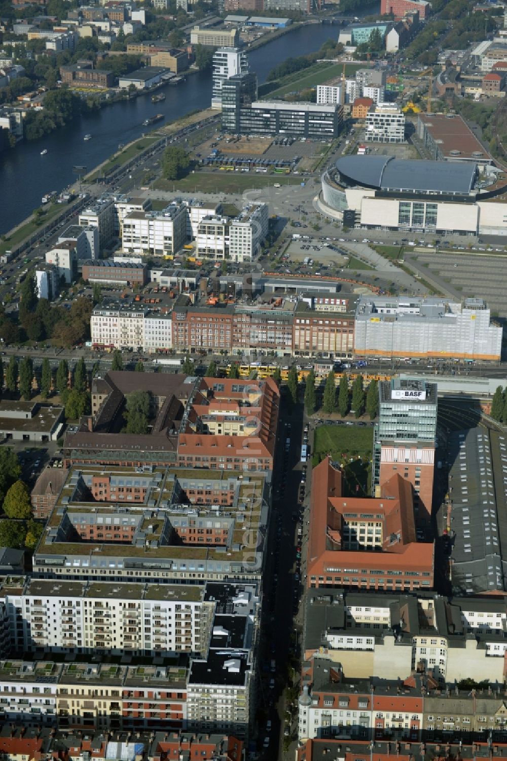 Berlin from above - View at the restored building of the monument protected former Osram respectively Narva company premises Oberbaum City in the district Friedrichshain in Berlin. Here, among many other companies, BASF Services Europe, the German Post Customer Service Center GmbH and Heineken Germany GmbH are located. It is owned by HVB Immobilien AG, which is part of the UniCredit Group