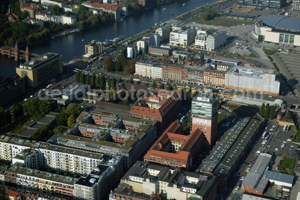 Aerial photograph Berlin - View at the restored building of the monument protected former Osram respectively Narva company premises Oberbaum City in the district Friedrichshain in Berlin. Here, among many other companies, BASF Services Europe, the German Post Customer Service Center GmbH and Heineken Germany GmbH are located. It is owned by HVB Immobilien AG, which is part of the UniCredit Group