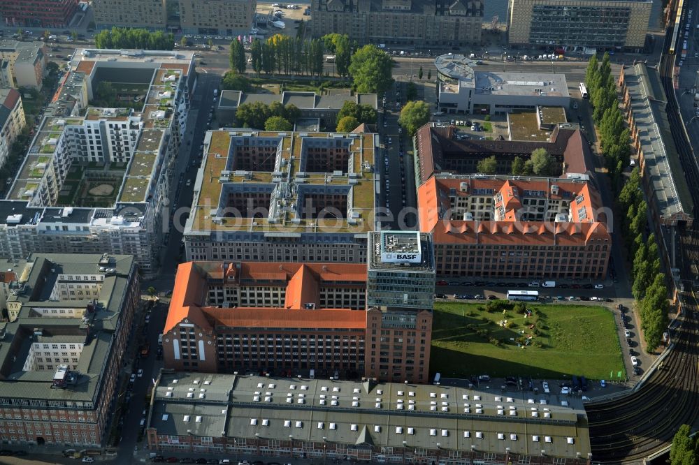 Berlin from above - View at the restored building of the monument protected former Osram respectively Narva company premises Oberbaum City in the district Friedrichshain in Berlin. Here, among many other companies, BASF Services Europe, the German Post Customer Service Center GmbH and Heineken Germany GmbH are located. It is owned by HVB Immobilien AG, which is part of the UniCredit Group