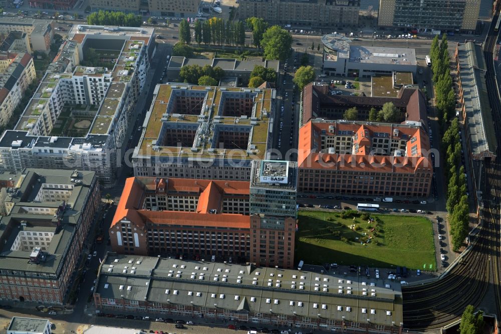 Berlin from the bird's eye view: View at the restored building of the monument protected former Osram respectively Narva company premises Oberbaum City in the district Friedrichshain in Berlin. Here, among many other companies, BASF Services Europe, the German Post Customer Service Center GmbH and Heineken Germany GmbH are located. It is owned by HVB Immobilien AG, which is part of the UniCredit Group