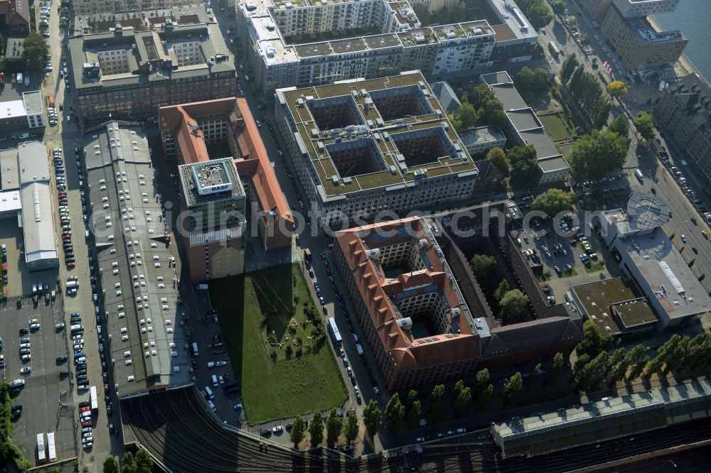 Aerial photograph Berlin - View at the restored building of the monument protected former Osram respectively Narva company premises Oberbaum City in the district Friedrichshain in Berlin. Here, among many other companies, BASF Services Europe, the German Post Customer Service Center GmbH and Heineken Germany GmbH are located. It is owned by HVB Immobilien AG, which is part of the UniCredit Group