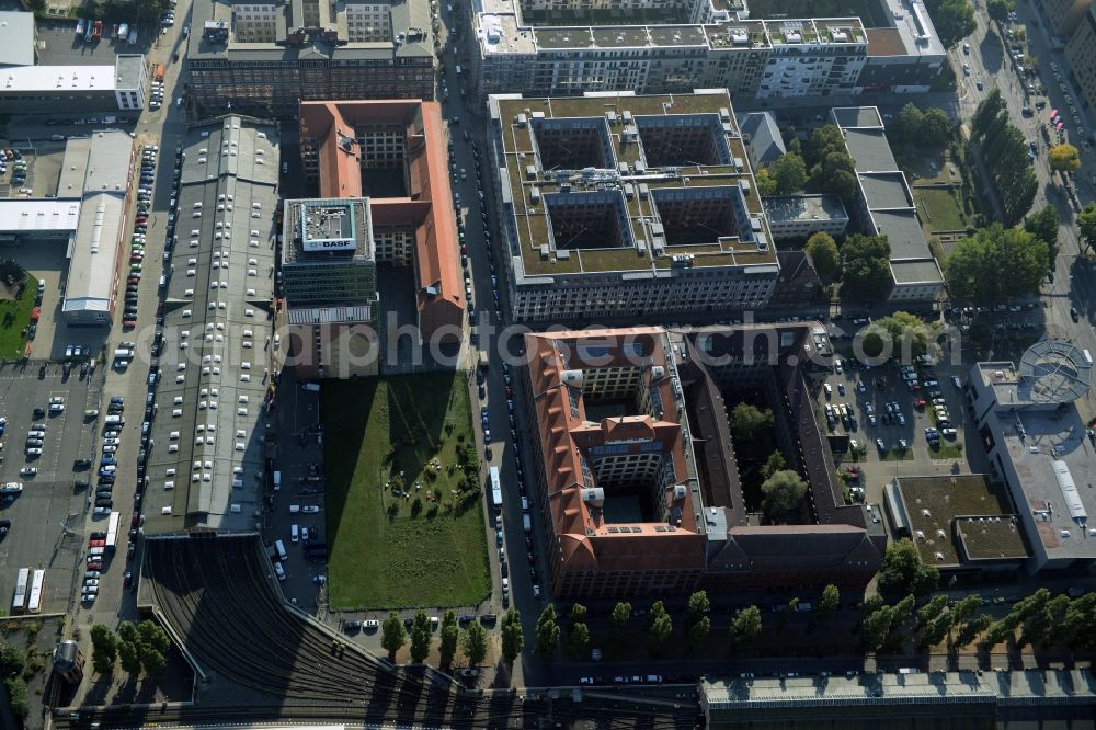 Berlin from above - View at the restored building of the monument protected former Osram respectively Narva company premises Oberbaum City in the district Friedrichshain in Berlin. Here, among many other companies, BASF Services Europe, the German Post Customer Service Center GmbH and Heineken Germany GmbH are located. It is owned by HVB Immobilien AG, which is part of the UniCredit Group