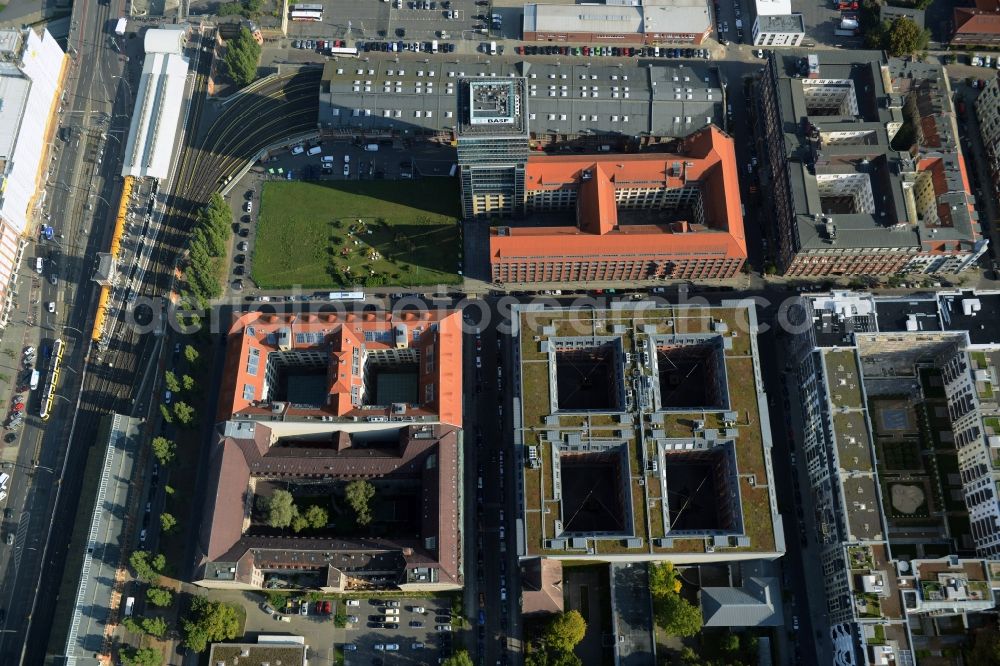 Aerial photograph Berlin - View at the restored building of the monument protected former Osram respectively Narva company premises Oberbaum City in the district Friedrichshain in Berlin. Here, among many other companies, BASF Services Europe, the German Post Customer Service Center GmbH and Heineken Germany GmbH are located. It is owned by HVB Immobilien AG, which is part of the UniCredit Group