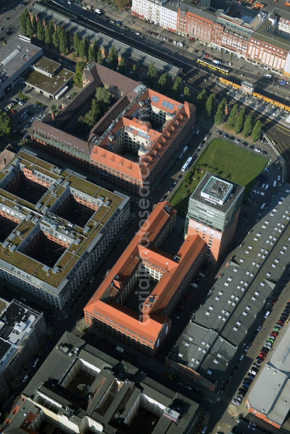 Berlin from above - View at the restored building of the monument protected former Osram respectively Narva company premises Oberbaum City in the district Friedrichshain in Berlin. Here, among many other companies, BASF Services Europe, the German Post Customer Service Center GmbH and Heineken Germany GmbH are located. It is owned by HVB Immobilien AG, which is part of the UniCredit Group