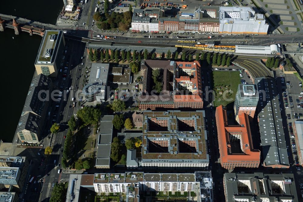 Berlin from above - View at the restored building of the monument protected former Osram respectively Narva company premises Oberbaum City in the district Friedrichshain in Berlin. Here, among many other companies, BASF Services Europe, the German Post Customer Service Center GmbH and Heineken Germany GmbH are located. It is owned by HVB Immobilien AG, which is part of the UniCredit Group