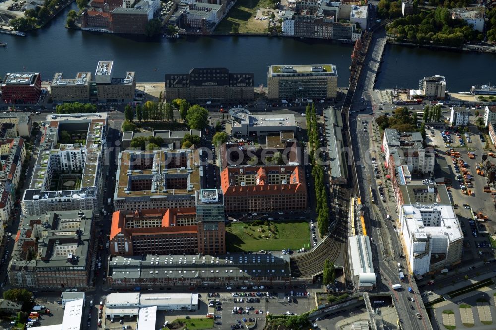 Berlin from above - View at the restored building of the monument protected former Osram respectively Narva company premises Oberbaum City in the district Friedrichshain in Berlin. Here, among many other companies, BASF Services Europe, the German Post Customer Service Center GmbH and Heineken Germany GmbH are located. It is owned by HVB Immobilien AG, which is part of the UniCredit Group