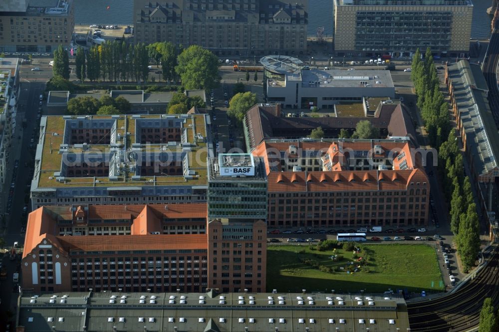 Aerial image Berlin - View at the restored building of the monument protected former Osram respectively Narva company premises Oberbaum City in the district Friedrichshain in Berlin. Here, among many other companies, BASF Services Europe, the German Post Customer Service Center GmbH and Heineken Germany GmbH are located. It is owned by HVB Immobilien AG, which is part of the UniCredit Group