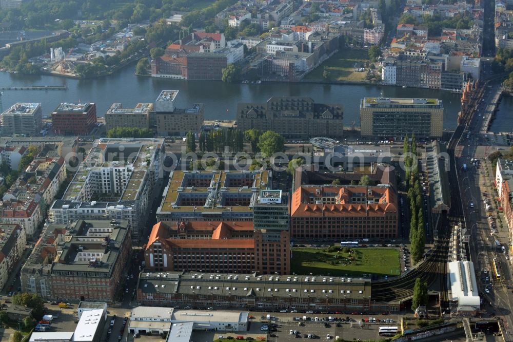 Berlin from above - View at the restored building of the monument protected former Osram respectively Narva company premises Oberbaum City in the district Friedrichshain in Berlin. Here, among many other companies, BASF Services Europe, the German Post Customer Service Center GmbH and Heineken Germany GmbH are located. It is owned by HVB Immobilien AG, which is part of the UniCredit Group