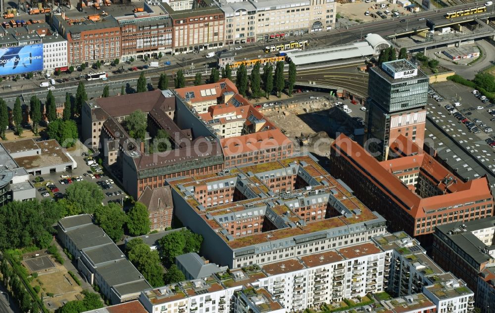 Berlin from above - View at the restored building of the monument protected former Osram respectively Narva company premises Oberbaum City in the district Friedrichshain in Berlin. Here, among many other companies, BASF Services Europe, the German Post Customer Service Center GmbH and Heineken Germany GmbH are located. It is owned by HVB Immobilien AG, which is part of the UniCredit Group