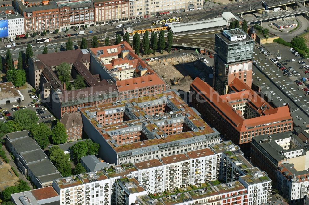 Berlin from the bird's eye view: View at the restored building of the monument protected former Osram respectively Narva company premises Oberbaum City in the district Friedrichshain in Berlin. Here, among many other companies, BASF Services Europe, the German Post Customer Service Center GmbH and Heineken Germany GmbH are located. It is owned by HVB Immobilien AG, which is part of the UniCredit Group