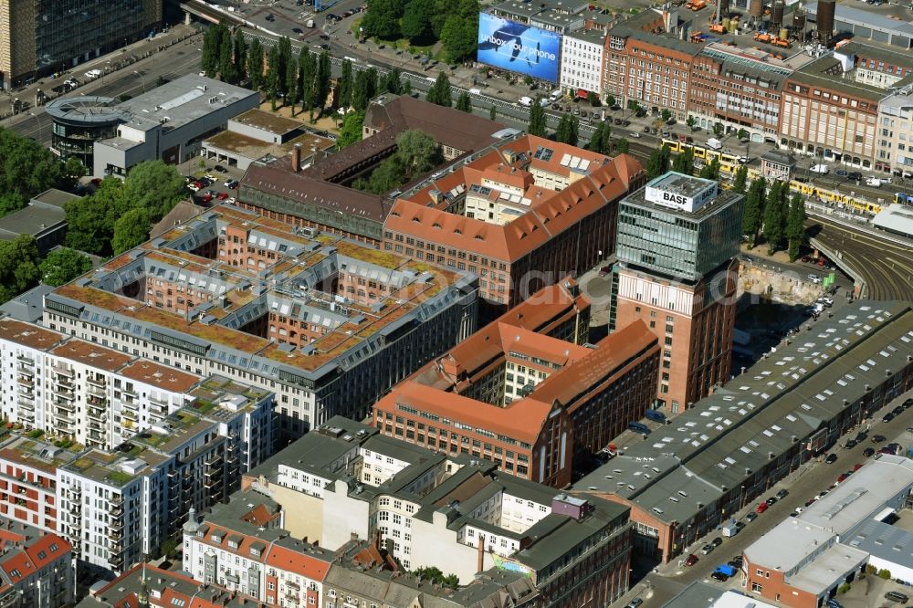 Aerial photograph Berlin - View at the restored building of the monument protected former Osram respectively Narva company premises Oberbaum City in the district Friedrichshain in Berlin. Here, among many other companies, BASF Services Europe, the German Post Customer Service Center GmbH and Heineken Germany GmbH are located. It is owned by HVB Immobilien AG, which is part of the UniCredit Group