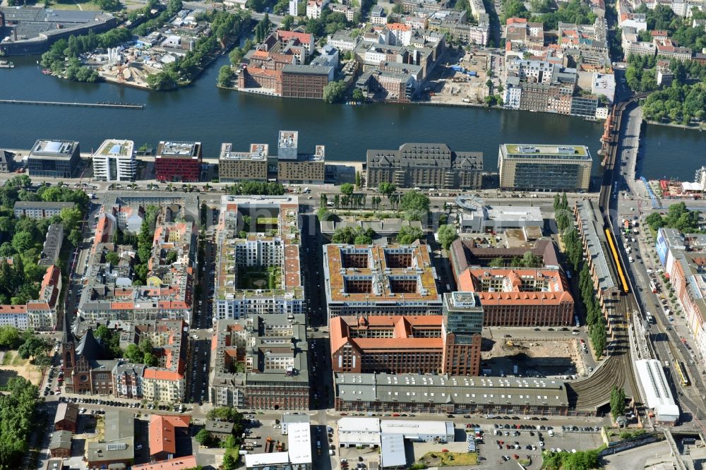 Berlin from above - View at the restored building of the monument protected former Osram respectively Narva company premises Oberbaum City in the district Friedrichshain in Berlin. Here, among many other companies, BASF Services Europe, the German Post Customer Service Center GmbH and Heineken Germany GmbH are located. It is owned by HVB Immobilien AG, which is part of the UniCredit Group