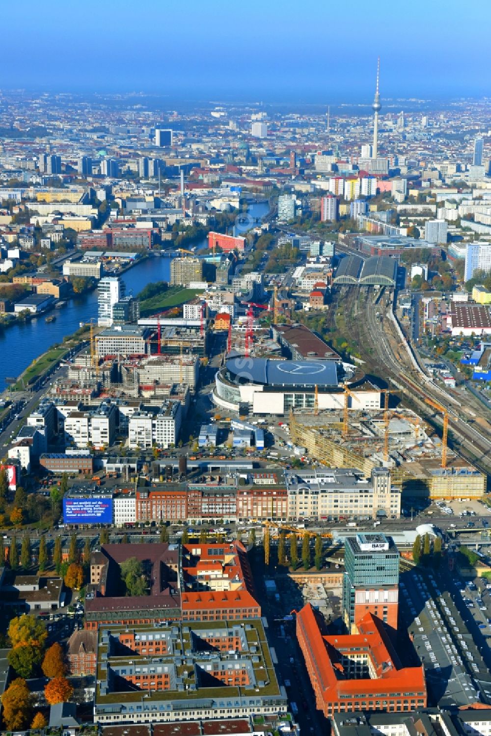 Berlin from above - View at the restored building of the monument protected former Osram respectively Narva company premises Oberbaum City in the district Friedrichshain in Berlin. Here, among many other companies, BASF Services Europe, the German Post Customer Service Center GmbH and Heineken Germany GmbH are located. It is owned by HVB Immobilien AG, which is part of the UniCredit Group