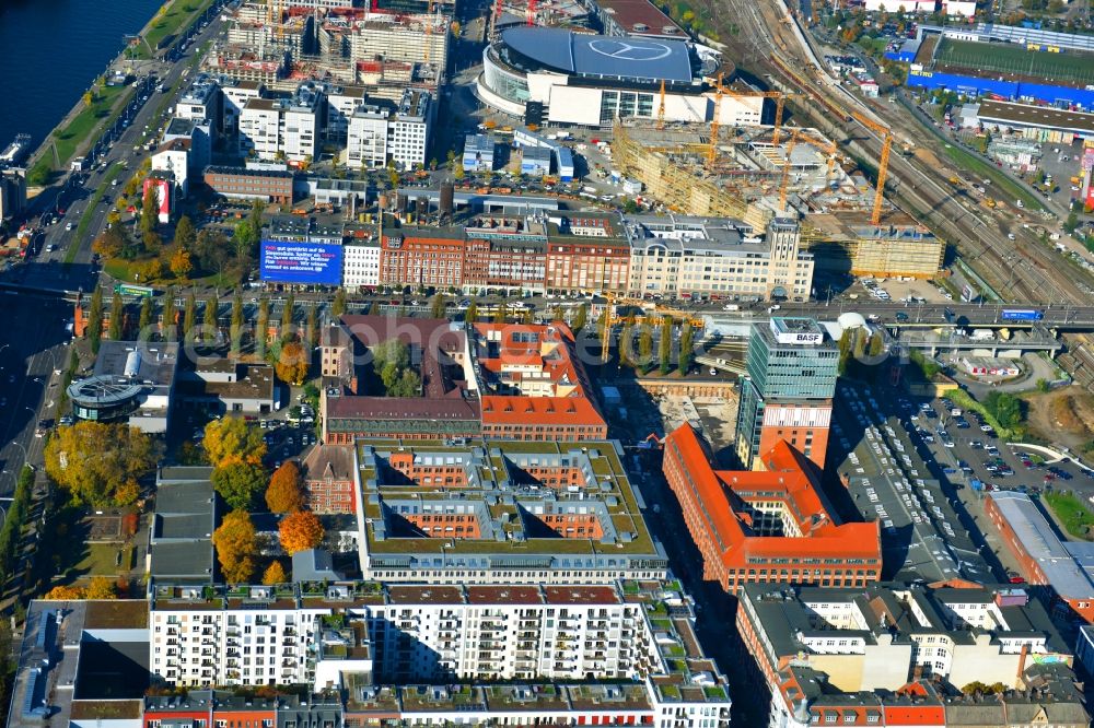 Aerial image Berlin - View at the restored building of the monument protected former Osram respectively Narva company premises Oberbaum City in the district Friedrichshain in Berlin. Here, among many other companies, BASF Services Europe, the German Post Customer Service Center GmbH and Heineken Germany GmbH are located. It is owned by HVB Immobilien AG, which is part of the UniCredit Group