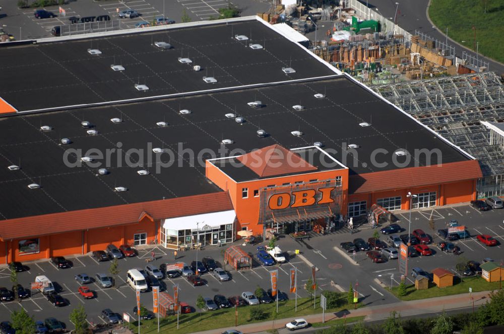 Aerial photograph Grimma - Blick auf den OBI Baumarkt in Grimma. Der Baumarkt hat eine vielseitige Auswahl in den Bereichen Eisenwaren/ Maschinen, Farben/ Dekoration, Holz/ Bauen, Sanitär/ Fliesen, Elektro/ Leuchten, Haushalt/ Ordnung, Garten. Kontakt: OBI Baumarkt Grimma, Hengstbergstr. 2, 04668 Grimma, Tel. +49(0)3437 92530 0, Fax +49(0)3437 92530 30,