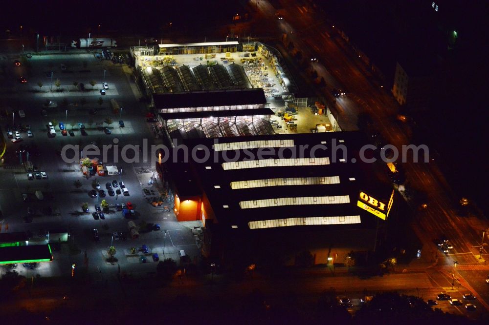 Berlin from the bird's eye view: Night image with a view over the OBI market Treptow at the street Adlergestell in the district Treptow-Koepenick in Berlin