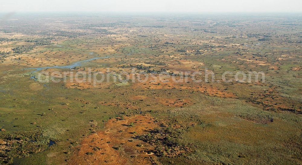 Aerial photograph Masarwa - Blick über das Okavangodelta im Nordwesten Botsuanas. Der Fluss Okavango versickert hier in das Kalaharibecken und bildet in diesem ansonsten trockenen Areal eines der größten und tierreichsten Feuchtgebiete Afrikas. View over the Okavango Delta in northwestern Botswana. It is formed where the Okavango River empties onto a swamp in an basin in the Kalahari Desert. The yearly floods creating one of Africa’s greatest wetlands and concentrations of wildlife.