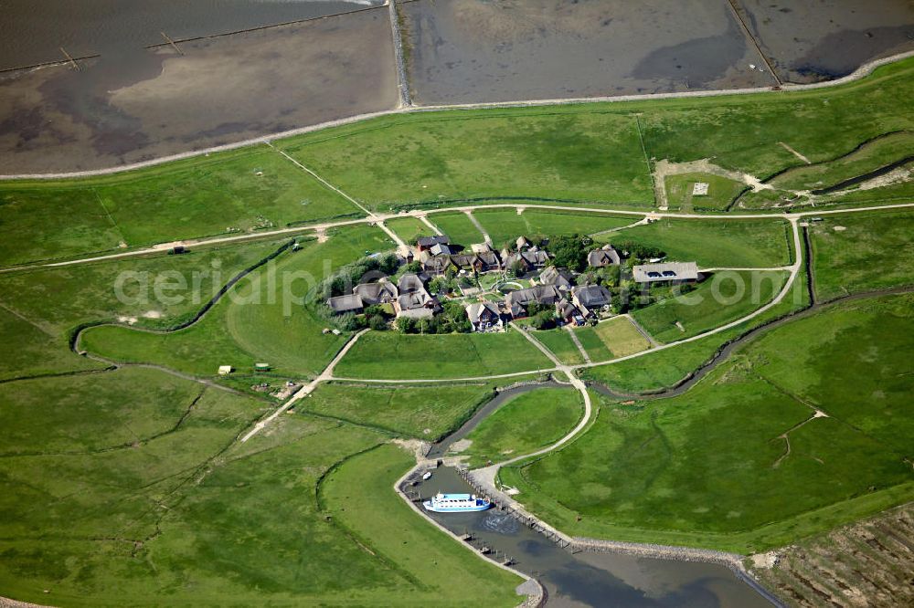 Aerial photograph Oland - Oland is a small hallig which is connected by a narrow gauge railway to the mainland and to hallig Langeneß. Germany's smallest lighthouse is located here, being also the only one with a thatched roof