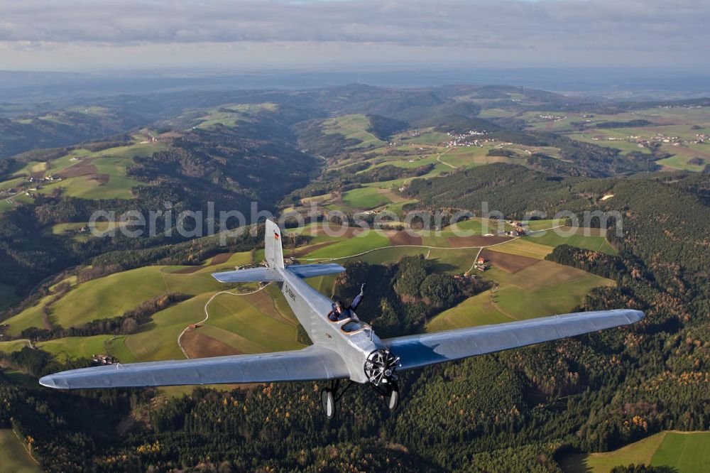 Aerial image Ampfing - Klassiker-Pilot Klaus Plasa fliegt ein Oldtimer Flugzeug vom Typ Klemm L 25 aus dem Jahr 1927 mit der Kennung D-EDMX über dem Flugplatz Ampfing EDNA in Bayern. Das älteste in Deutschland zugelassene flugtaugliche Flugzeug hat der BMW-Konzern 2008 restaurieren lassen. Antique aircraft over the Ampfing airfield in Bavaria.