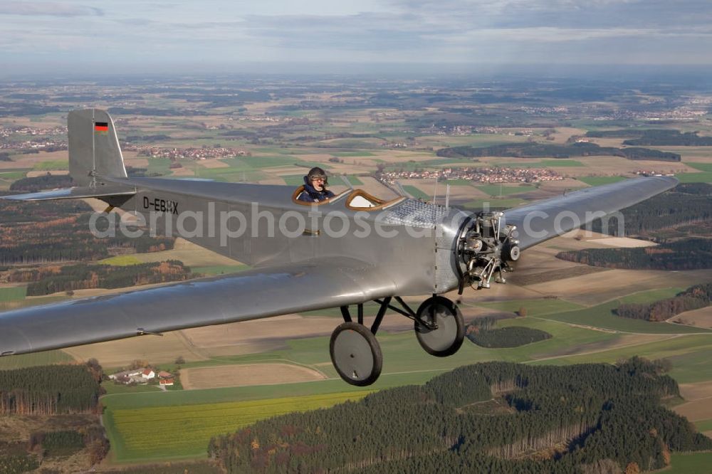 Aerial photograph Ampfing - Klassiker-Pilot Klaus Plasa fliegt ein Oldtimer Flugzeug vom Typ Klemm L 25 aus dem Jahr 1927 mit der Kennung D-EDMX über dem Flugplatz Ampfing EDNA in Bayern. Das älteste in Deutschland zugelassene flugtaugliche Flugzeug hat der BMW-Konzern 2008 restaurieren lassen. Antique aircraft over the Ampfing airfield in Bavaria.