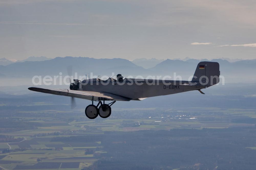 Aerial photograph Ampfing - Klassiker-Pilot Klaus Plasa fliegt ein Oldtimer Flugzeug vom Typ Klemm L 25 aus dem Jahr 1927 mit der Kennung D-EDMX über dem Flugplatz Ampfing EDNA in Bayern. Das älteste in Deutschland zugelassene flugtaugliche Flugzeug hat der BMW-Konzern 2008 restaurieren lassen. Antique aircraft over the Ampfing airfield in Bavaria.