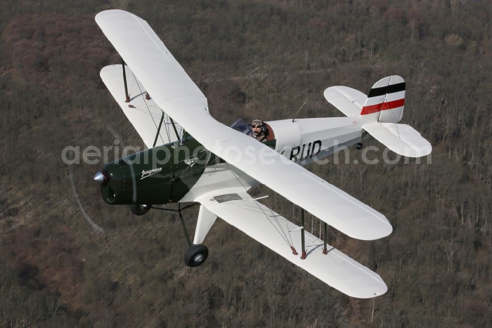 Mengen from above - Classic flight replica CASA Buecker Jungmann 131 in flight at Mengen in the state of Baden-Wuerttemberg