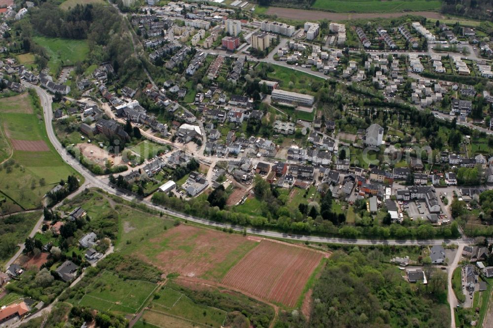 Trier from the bird's eye view: View on the village Olewig. The district lies in the valley Olewiger. Hilly residential area with single-family and multi-family homes that have been built partly on a slope. The district is located in Trier in Rhineland-Palatinate