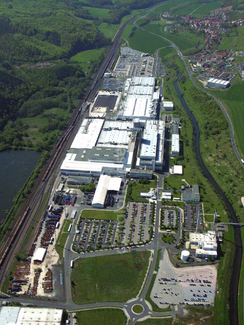 Aerial photograph Eisenach - Blick auf das Opelwerk in Eisenach. In dem eisenacher Opelwerk produzieren ca. 1900 Mitarbeiter den Opel Corsa. Opel ist seit 1992 in Eisenach mit der Opel Eisenach GmbH vertreten. Kontakt: Opel Eisenach GmbH, Adam-Opel-Strasse 100, 99817 Eisenach, Tel. +49(0)3691 66-0, Fax +49(0)3691 66-1121