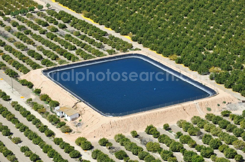 Aerial photograph Los Martinez - Detention reservoir on irrigation levels for the cultivation of oranges and lemons near the city Los Martinez in Spain