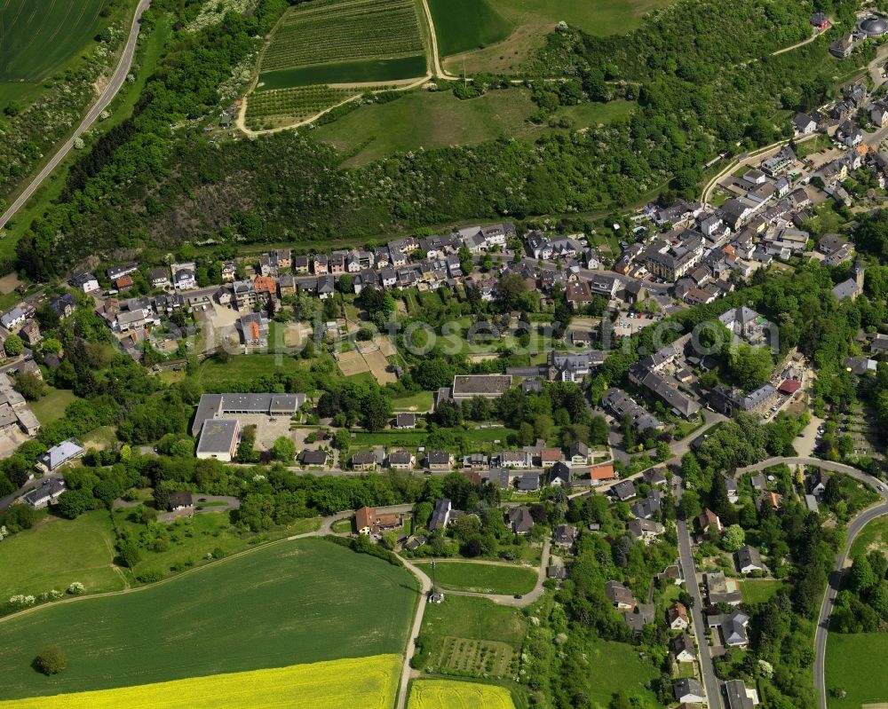 Aerial photograph Burgbrohl - View of the Luetzingen part of the borough of Burgbrohl in the state of Rhineland-Palatinate.Its residential area is agriculturally informed and surrounded by fields - rapeseed fields - and agricultural land