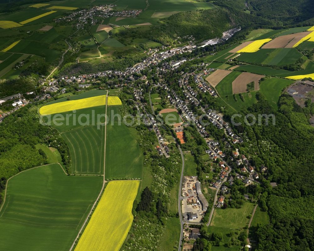 Burgbrohl from above - View of the Luetzingen part of the borough of Burgbrohl in the state of Rhineland-Palatinate.Its residential area is agriculturally informed and surrounded by fields - rapeseed fields - and agricultural land