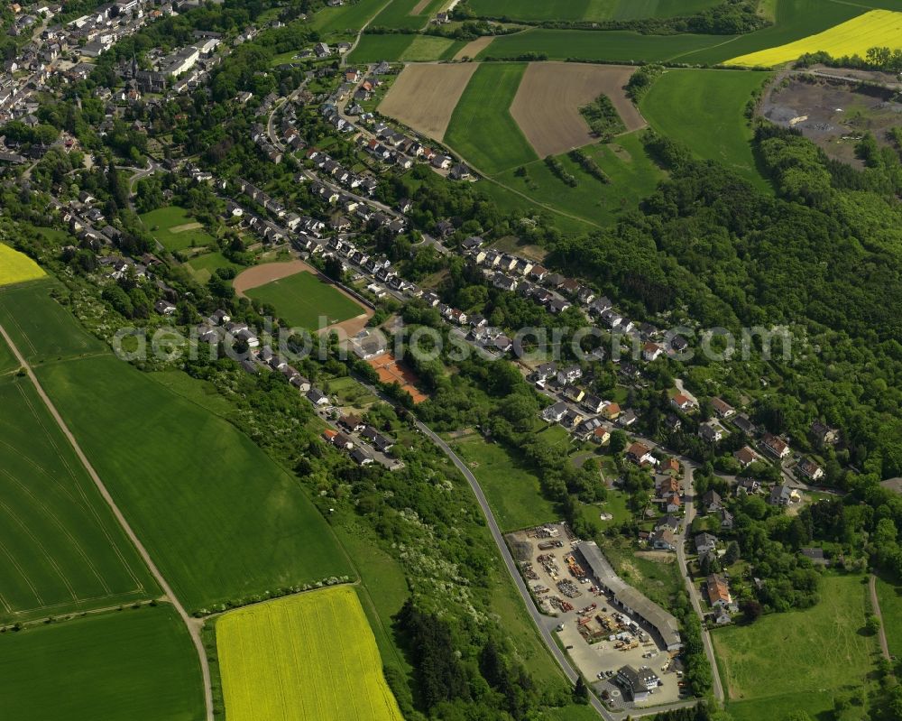 Aerial image Burgbrohl - View of the Luetzingen part of the borough of Burgbrohl in the state of Rhineland-Palatinate.Its residential area is agriculturally informed and surrounded by fields - rapeseed fields - and agricultural land