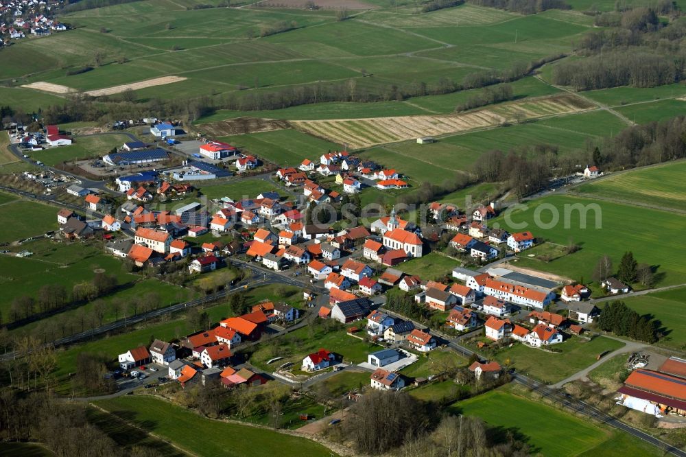 Batten from above - Town view of the streets and houses of the residential areas in Batten in the Rhoen in the state Hesse, Germany