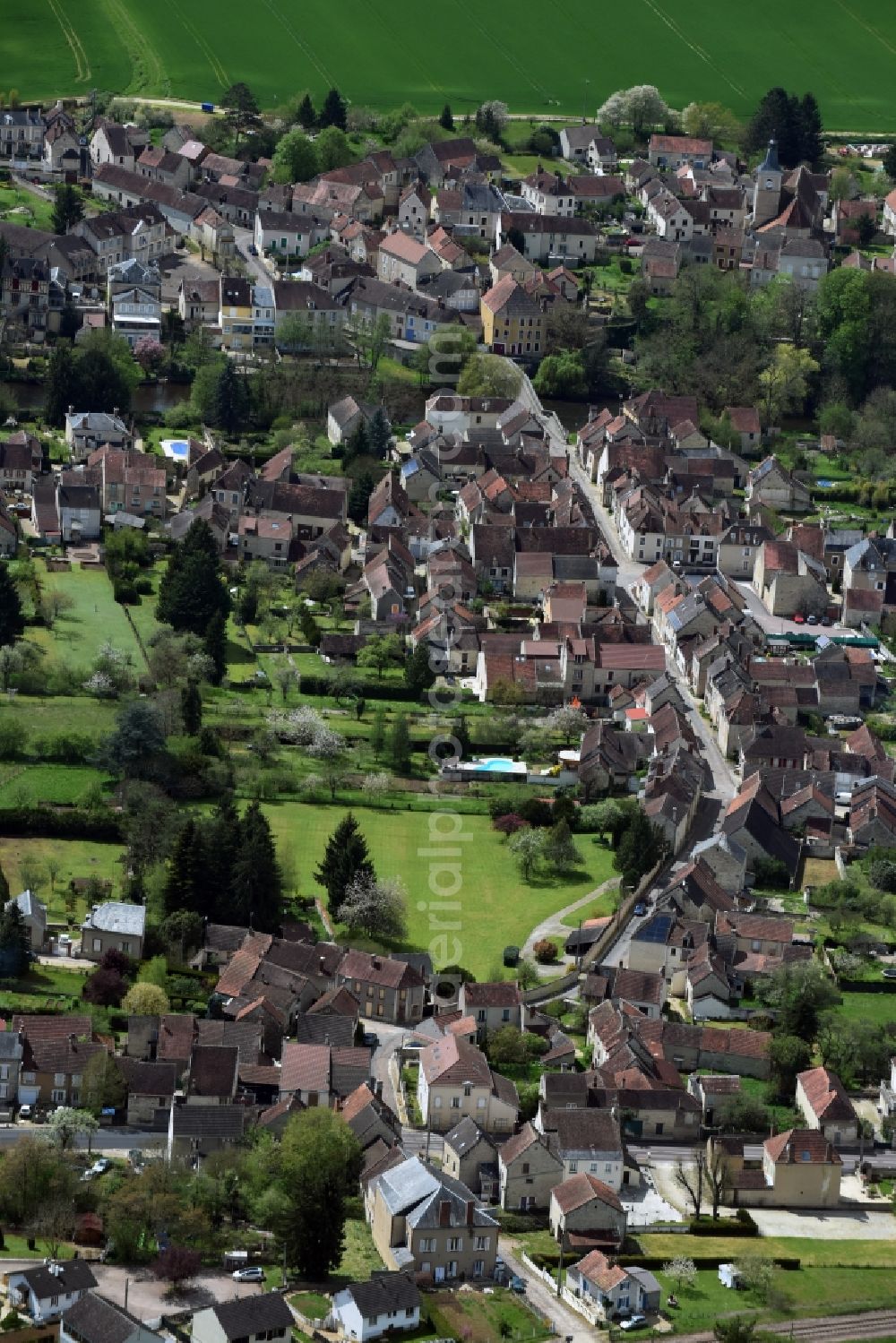 Aerial image Arcy-sur-Cure - Town View of the streets and houses of the residential areas in Arcy-sur-Cure in Bourgogne Franche-Comte, France