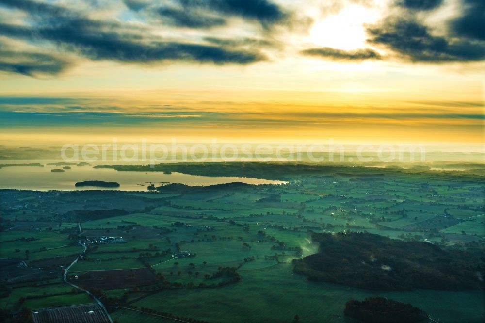 Aerial image Ascheberg - Town view of Ascheberg am Ploener See in the sunrise in the state Schleswig-Holstein, Germany