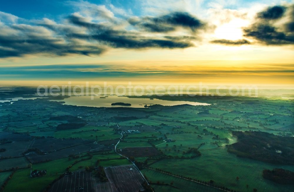 Aerial photograph Ascheberg - Town view of Ascheberg am Ploener See in the sunrise in the state Schleswig-Holstein, Germany