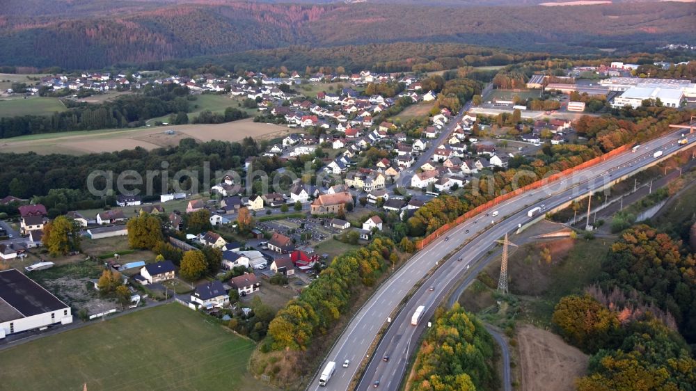 Fernthal from the bird's eye view: Town view of the streets and houses of the residential areas along the course of the motorway BAB A3 in Fernthal in the state Rhineland-Palatinate, Germany