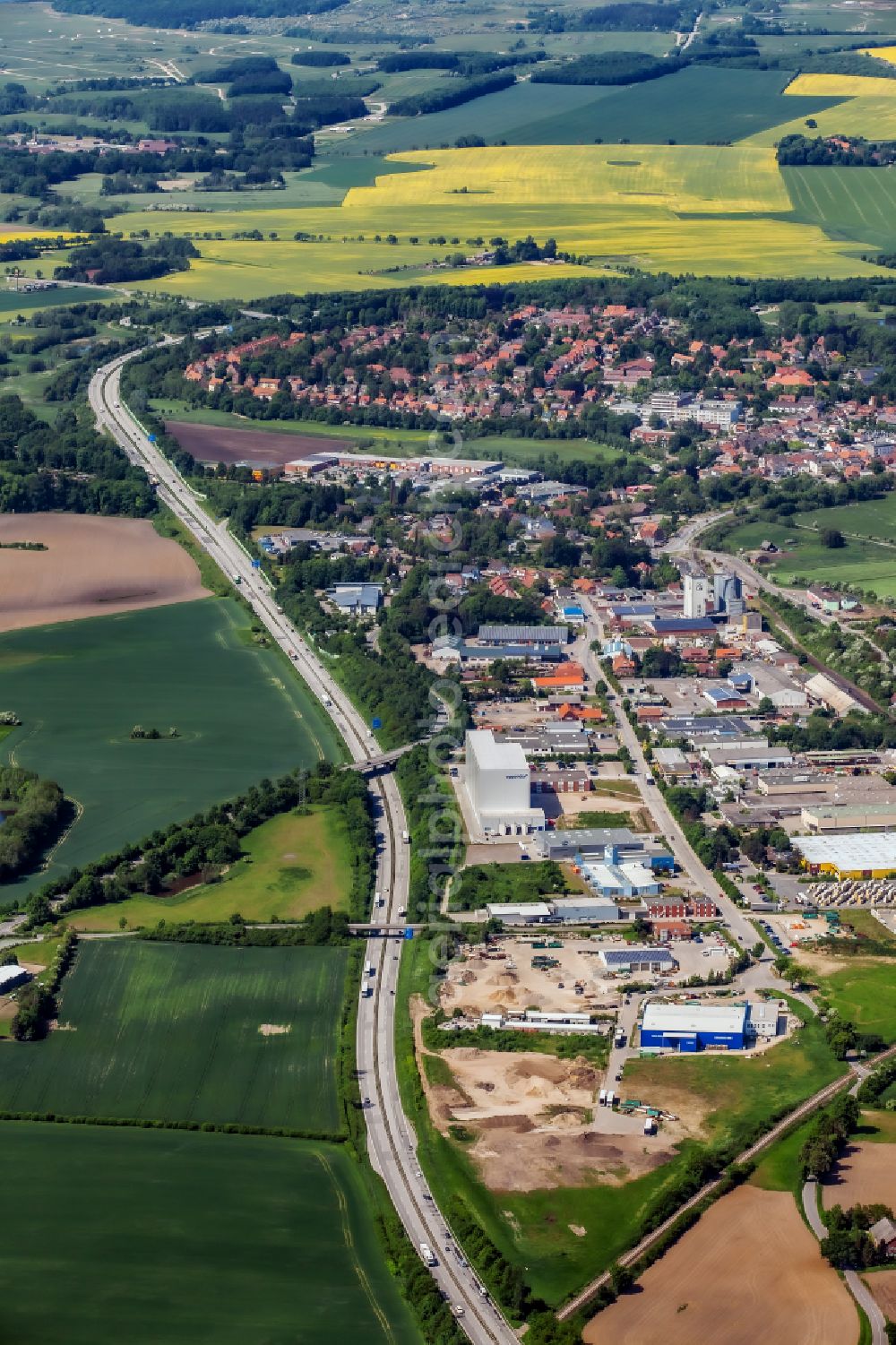 Oldenburg in Holstein from the bird's eye view: City view on the A1 motorway with industrial park in Oldenburg in Holstein in the state Schleswig-Holstein, Germany