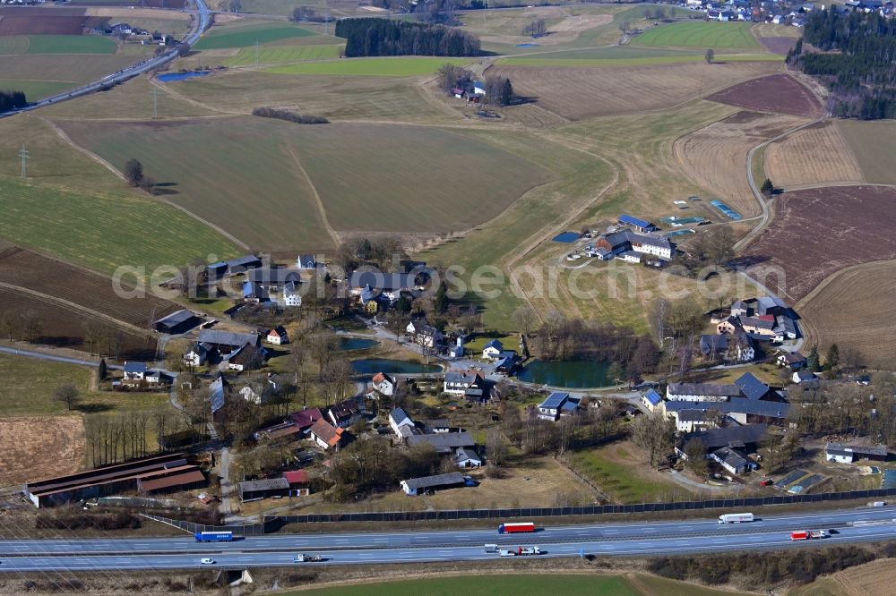 Aerial image Laubersreuth - Town view of the streets and houses of the residential areas along the course of the motorway in Laubersreuth in the state Bavaria, Germany