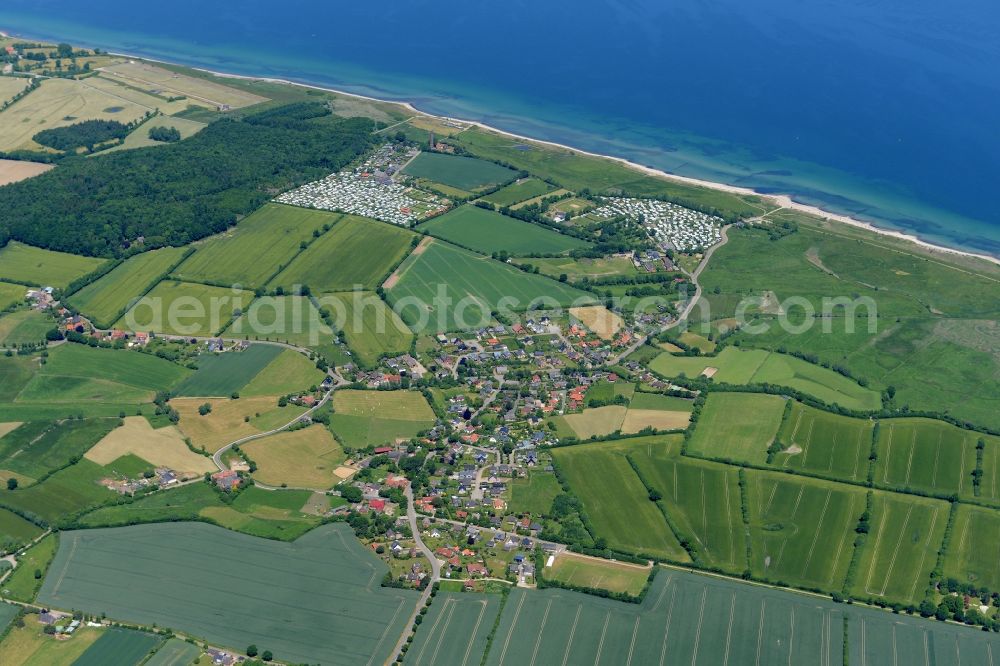 Behrensdorf from the bird's eye view: Town View of the local community Behrensdorf and its camping areas and the shore side of the baltic sea in the state Schleswig-Holstein